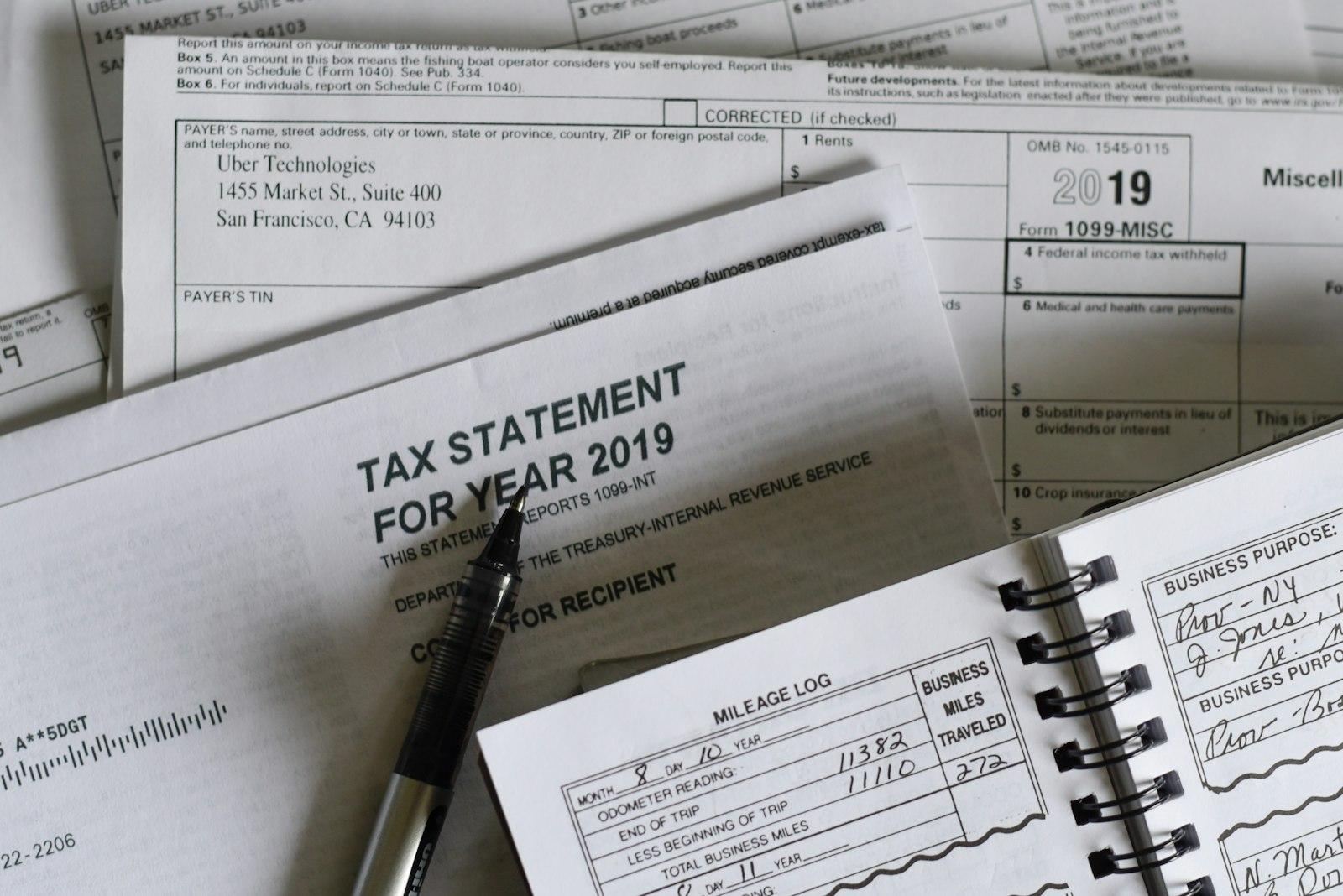 Disorganized financial documents on a desk